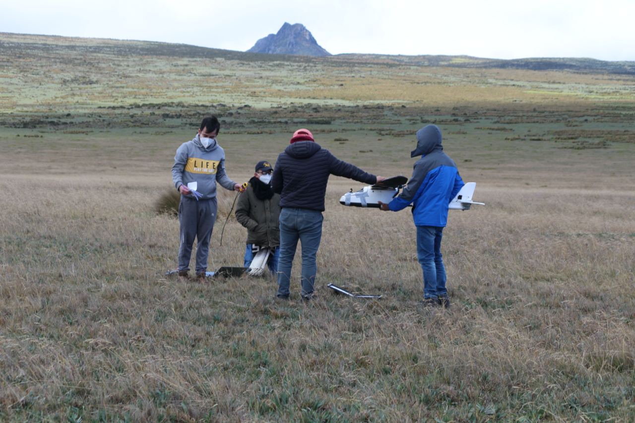Team review and preparation of the fixed-wing drone.