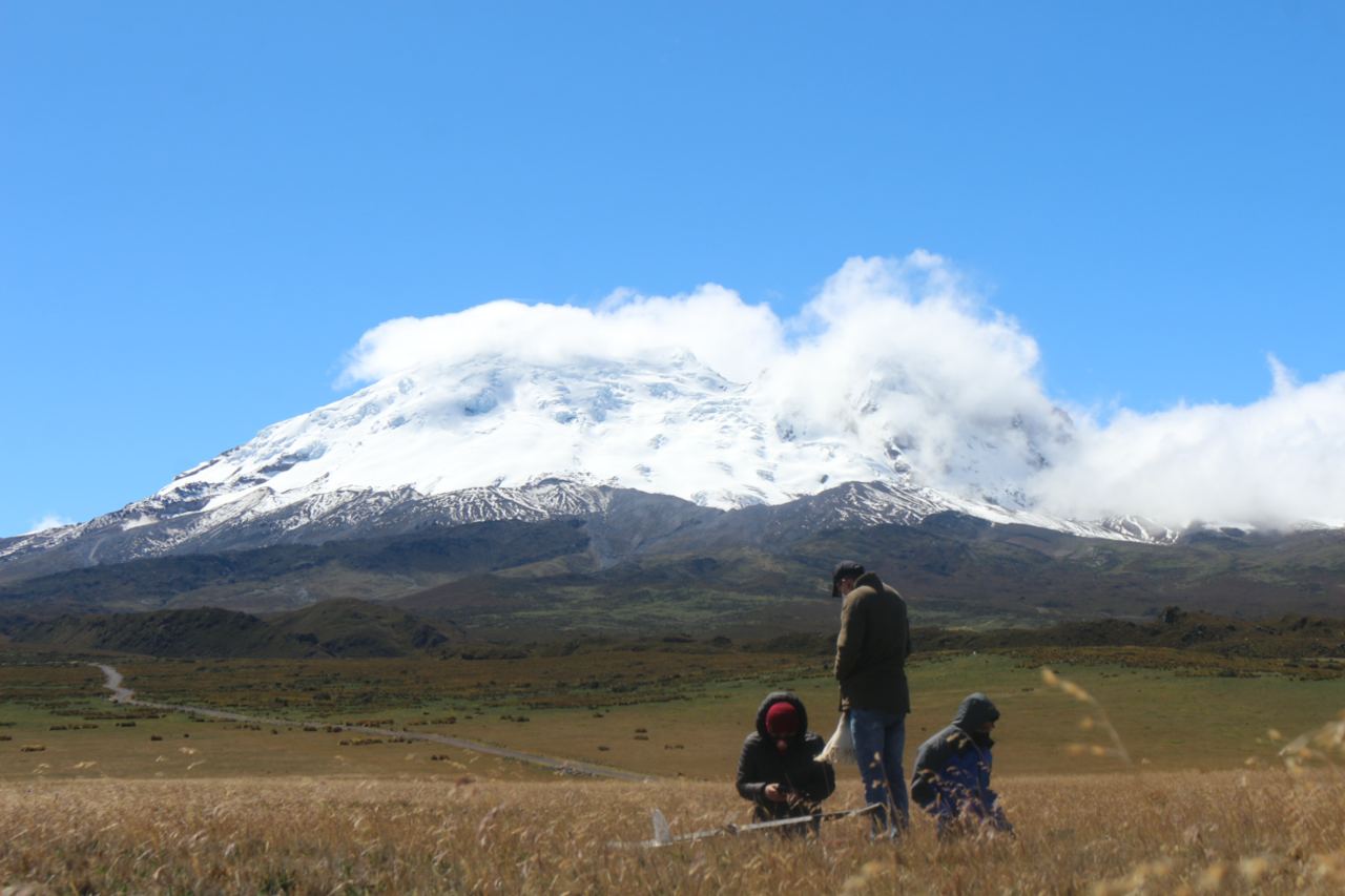 Installation of measurement equipment with the Antisana volcano in the background.